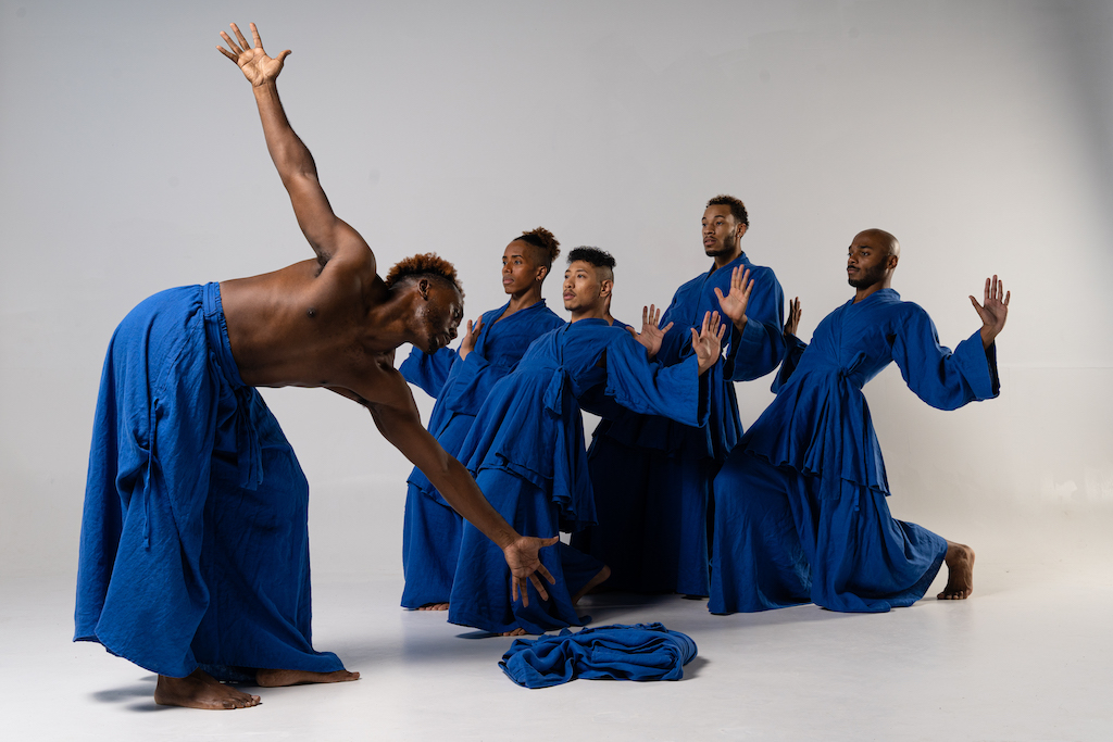 Group of Black dancers from the EVIDENCE, A Dance Company in mid-performance.